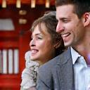 A happy couple, Jessica and Tom, smiling in front of a temple in Kyoto.