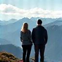 Sara and Jonas at the summit of a mountain in New Zealand.